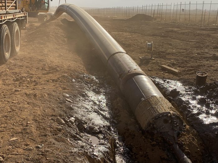 Drill pipe pushed into a trench