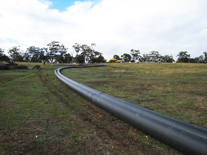 Drill pipes layed out on grass